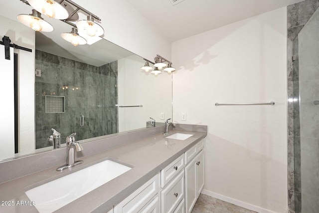 bathroom with a shower with door and vanity