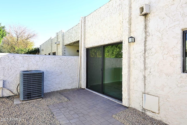 exterior space with a patio area and central AC