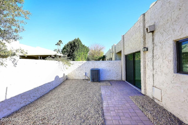 view of yard featuring a patio area and central air condition unit