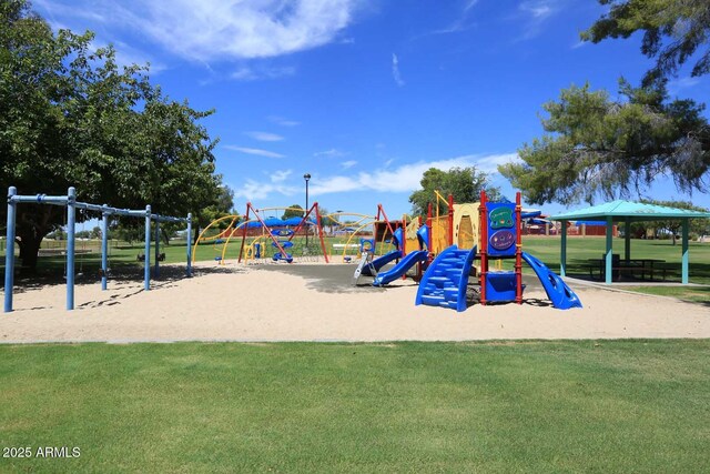 view of jungle gym featuring a lawn