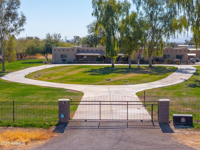 view of home's community featuring a yard