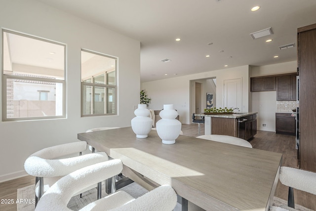 dining room with recessed lighting, dark wood-style floors, and visible vents