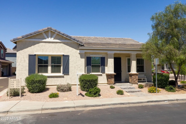 324 N 56th Pl, Mesa, AZ 85205 - view of front of property with a porch and stucco siding