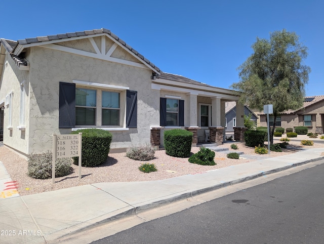 324 N 56th Pl, Mesa, AZ 85205 - view of front of house featuring stucco siding and a porch