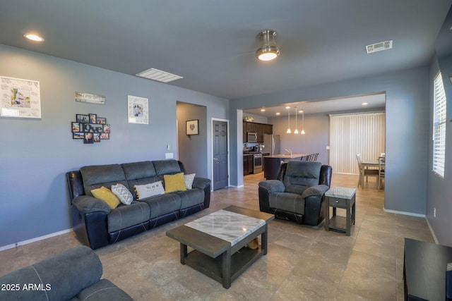 324 N 56th Pl, Mesa, AZ 85205 - living area with baseboards and recessed lighting