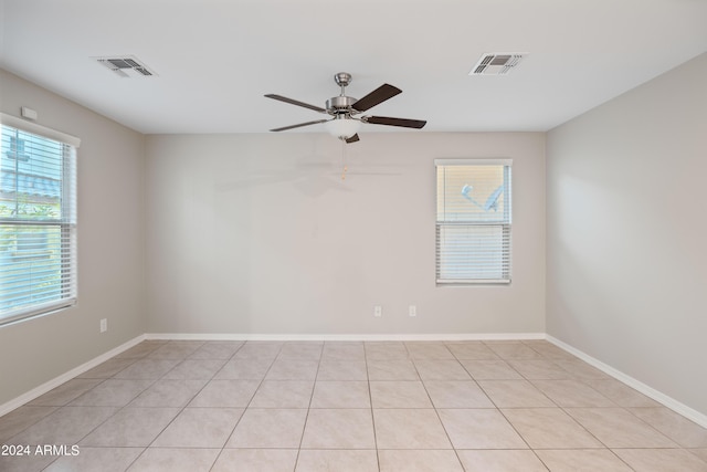 unfurnished room with ceiling fan