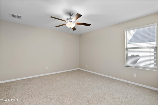 unfurnished room featuring ceiling fan and carpet flooring