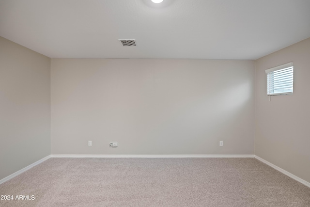 unfurnished room featuring carpet flooring