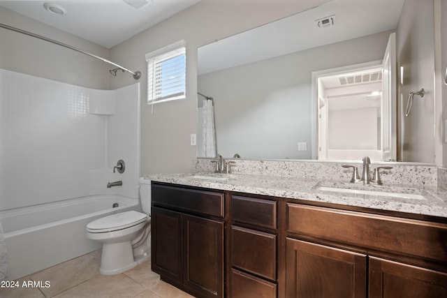 full bathroom featuring bathtub / shower combination, vanity, toilet, and tile patterned flooring