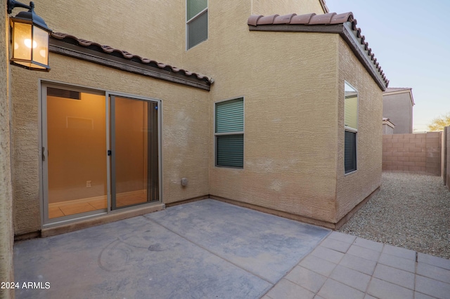 back of property featuring a patio