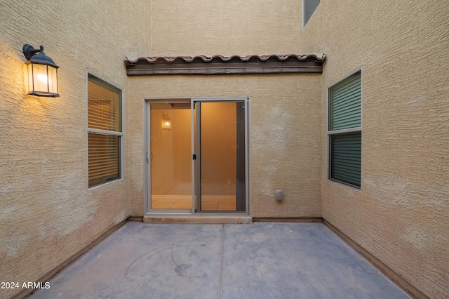 property entrance with a patio area