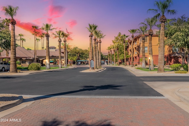 view of road with sidewalks and curbs