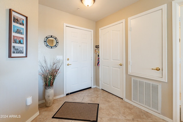 entrance foyer with light tile patterned floors