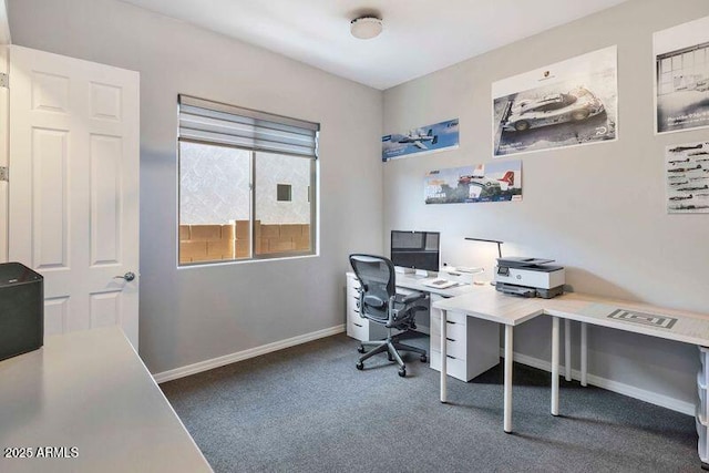 carpeted home office featuring baseboards