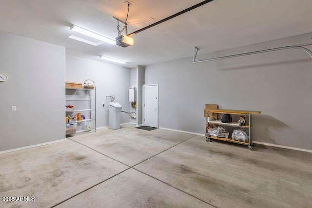 garage with baseboards and a garage door opener