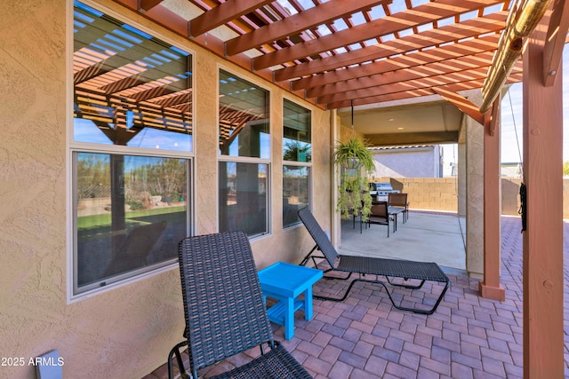 view of patio with fence and a pergola