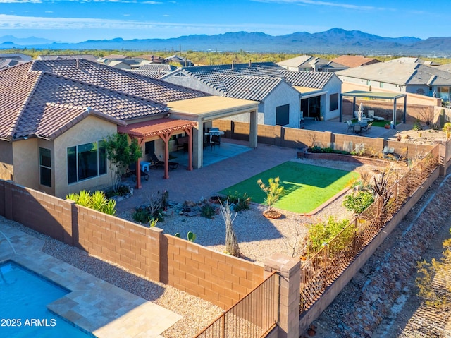 exterior space with a residential view and a mountain view