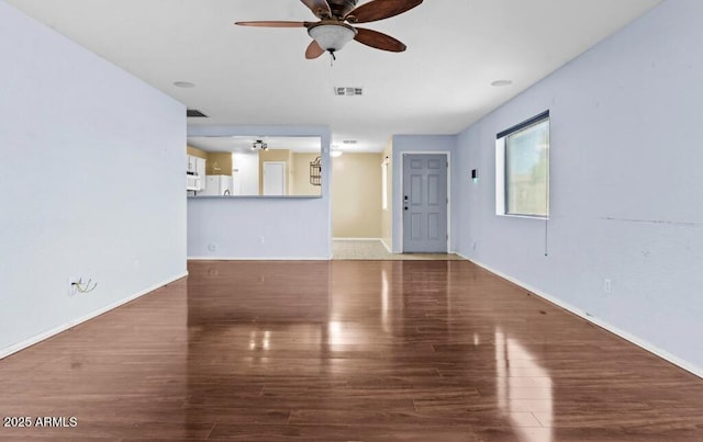 unfurnished living room with wood-type flooring and ceiling fan