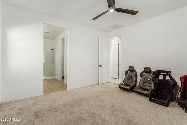 miscellaneous room featuring ceiling fan and light carpet