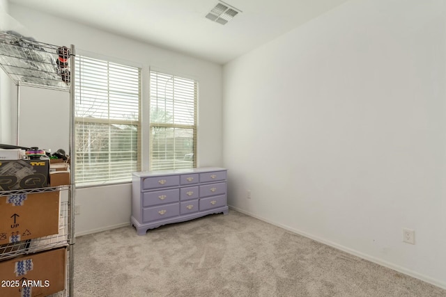 bedroom with light colored carpet