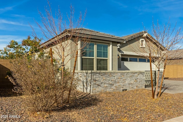 view of property exterior with a garage