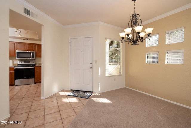 carpeted entrance foyer featuring a notable chandelier and ornamental molding