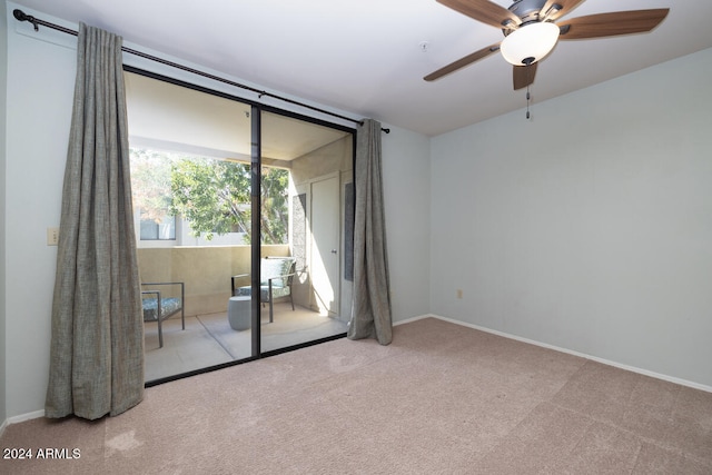 unfurnished room featuring light colored carpet and ceiling fan