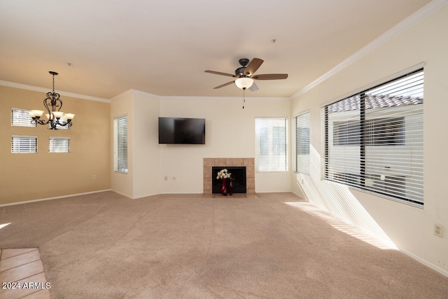 unfurnished living room with crown molding, light carpet, and plenty of natural light