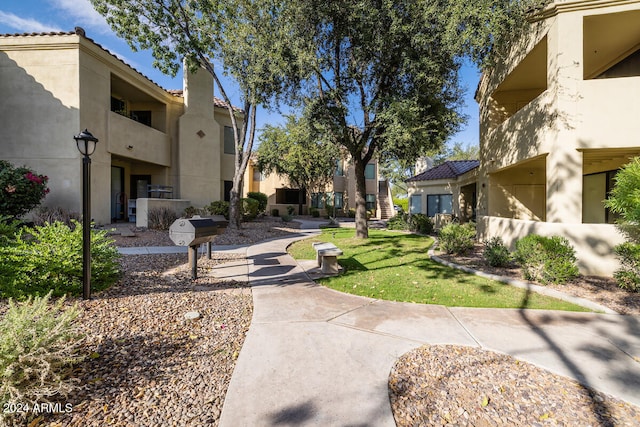 view of community featuring a lawn