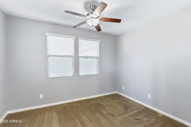 empty room featuring ceiling fan, baseboards, and carpet floors