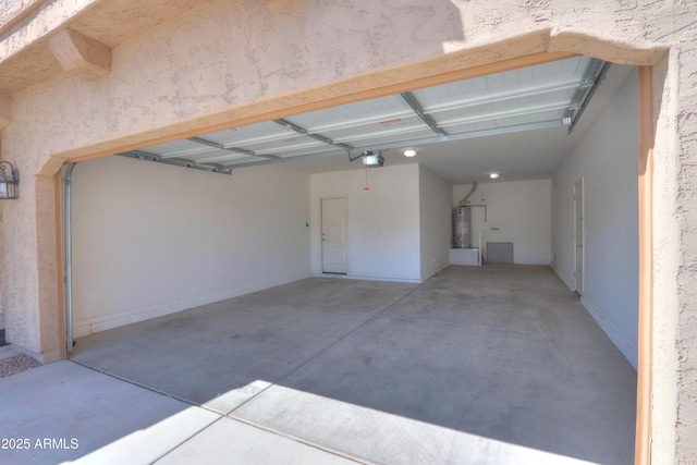 garage with a garage door opener and water heater