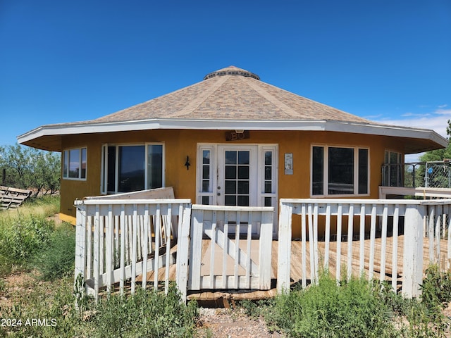 rear view of property with a deck