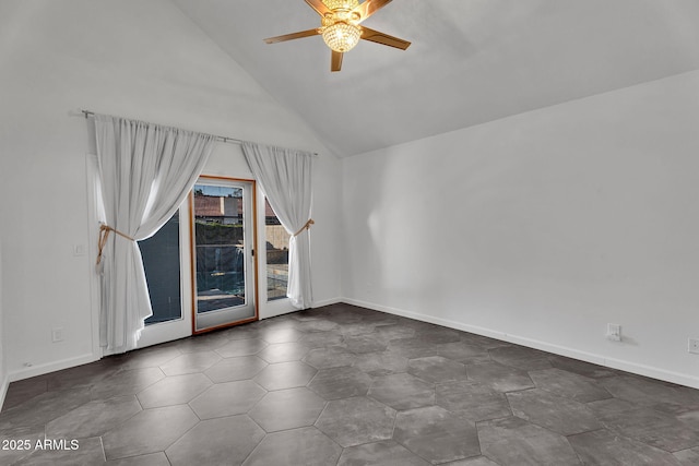 spare room featuring a ceiling fan, baseboards, and high vaulted ceiling