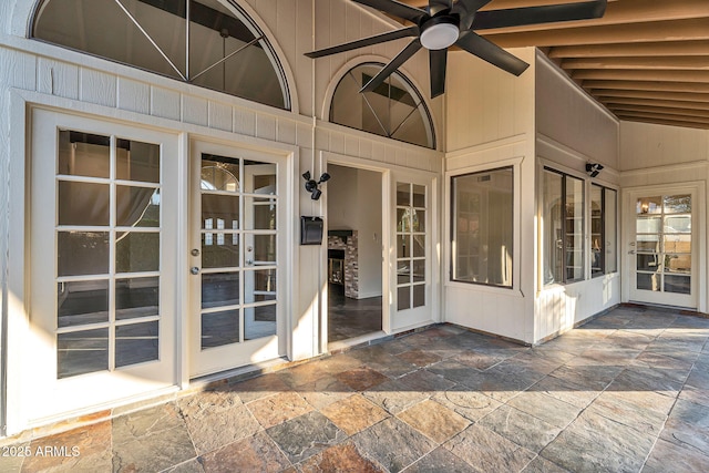 property entrance featuring a patio, french doors, and ceiling fan