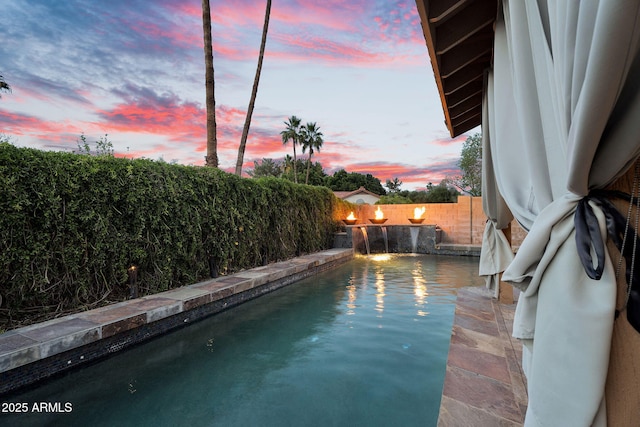 view of pool featuring a fenced backyard