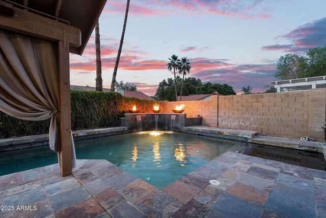 view of pool featuring a fenced backyard and a patio area