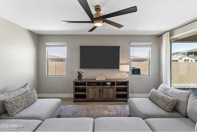 5430 W Notch Hill Rd, Laveen, AZ 85339 - living room with baseboards, healthy amount of natural light, wood finished floors, and ceiling fan