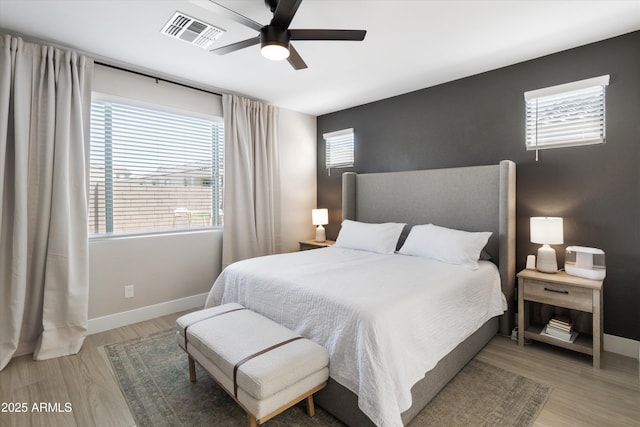 5430 W Notch Hill Rd, Laveen, AZ 85339 - bedroom featuring light wood-style floors, baseboards, and a ceiling fan