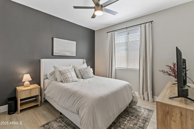5430 W Notch Hill Rd, Laveen, AZ 85339 - bedroom featuring light wood finished floors, a ceiling fan, and baseboards