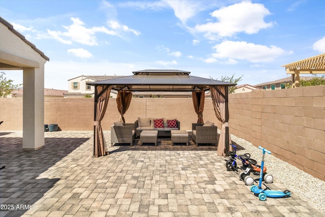 5430 W Notch Hill Rd, Laveen, AZ 85339 - view of patio / terrace with an outdoor hangout area, a gazebo, and a fenced backyard