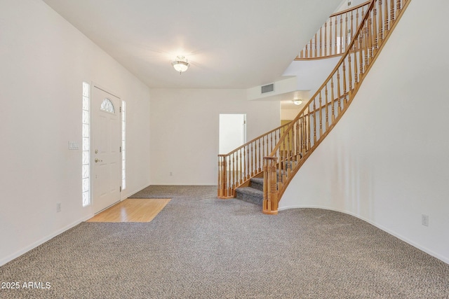 view of carpeted foyer