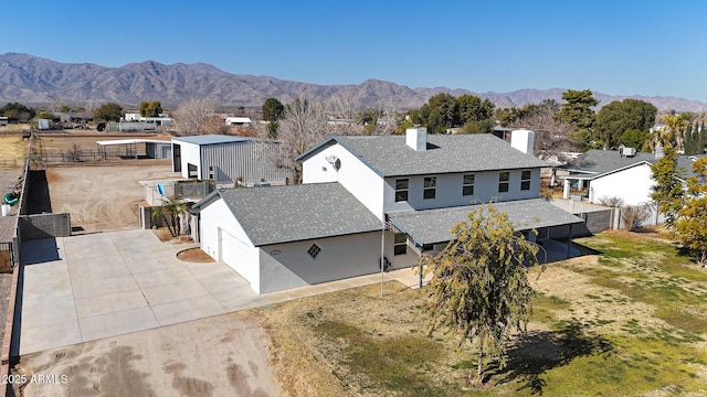 birds eye view of property featuring a mountain view