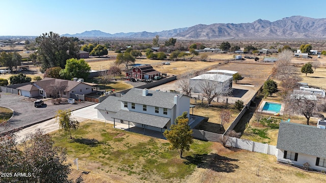 birds eye view of property with a mountain view