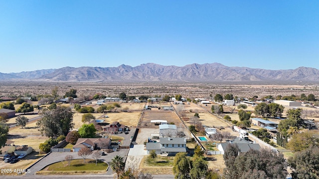 birds eye view of property with a mountain view