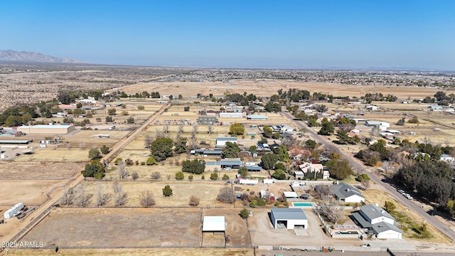 birds eye view of property featuring a mountain view