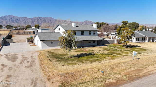 view of front of house featuring a mountain view