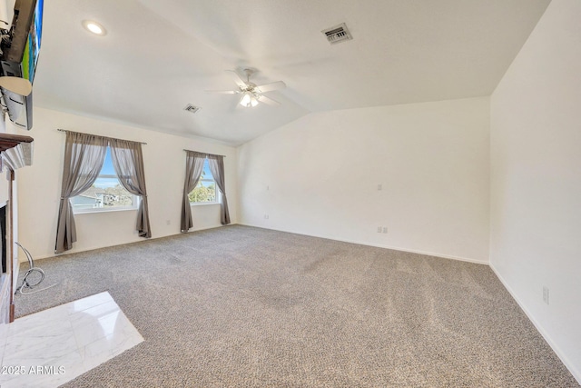 unfurnished living room with lofted ceiling, carpet floors, and ceiling fan