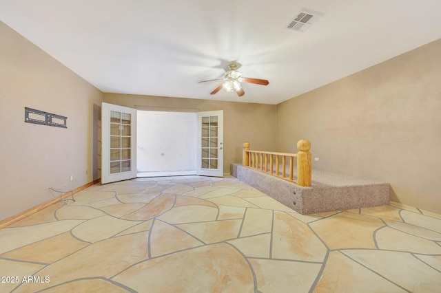 interior space with french doors and ceiling fan