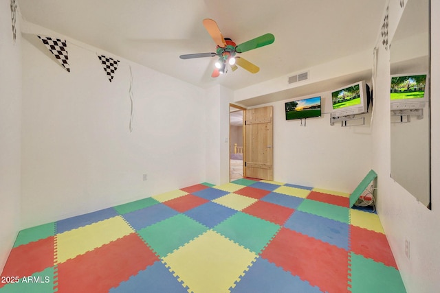 interior space featuring ceiling fan