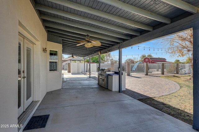 view of patio / terrace with area for grilling and ceiling fan